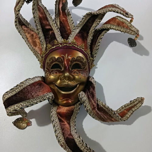 Decorative wall mask like new in burgundy and gold tones