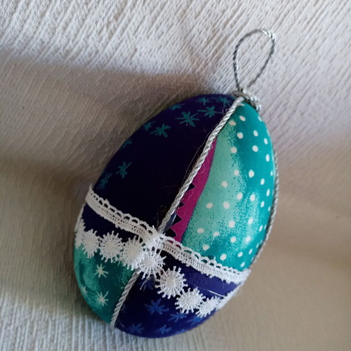 Decorative egg used blue light blue with stars and lace