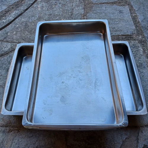 Set of two used stainless steel oven trays