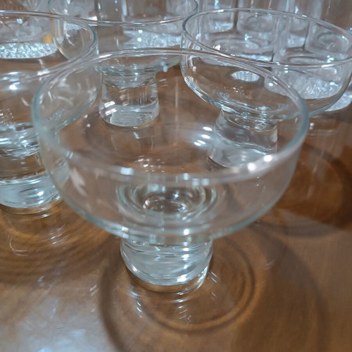 Set of 17 crystal glasses and bowls with carved details