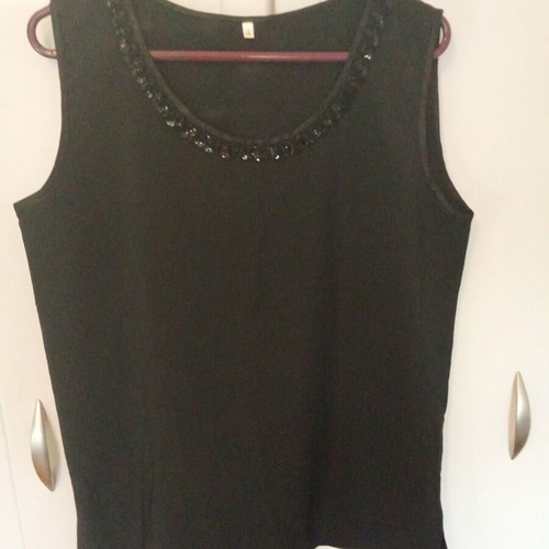 Black top with sequin detail like new