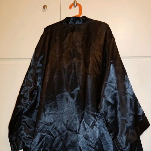 2 women's robes like new, one cream and one black with flower detail