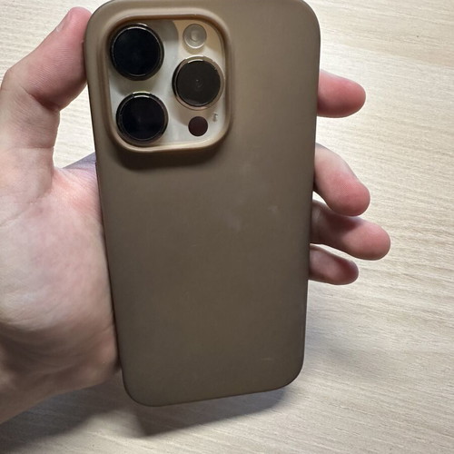 iPhone 14 Pro 128GB used, gold, with two cases, minor back crack