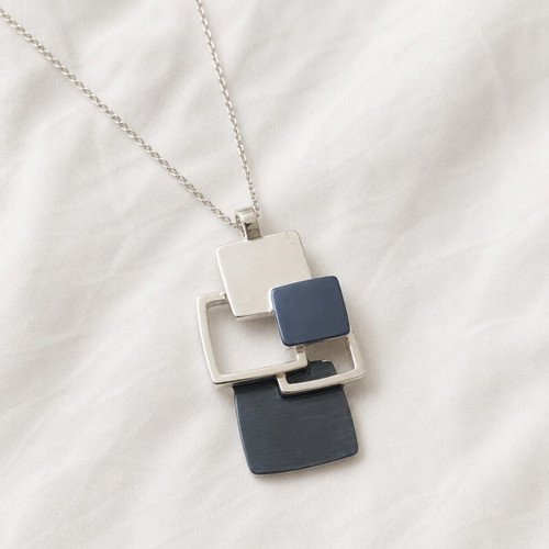 Geometric Blue necklace like new, modern design in silver and blue