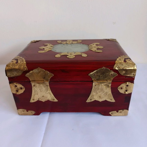 Wooden jewelry box used with brass decorative elements