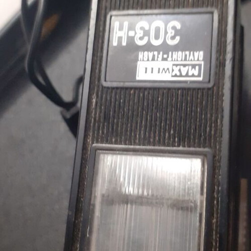 Canon Canonet QL19 camera used with flash and extra lens