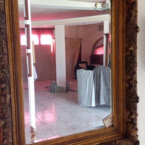 Antique mirror made of wood and plaster