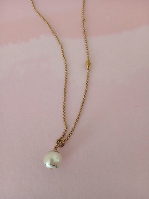 Juicy Couture necklace used with pearl and brand name