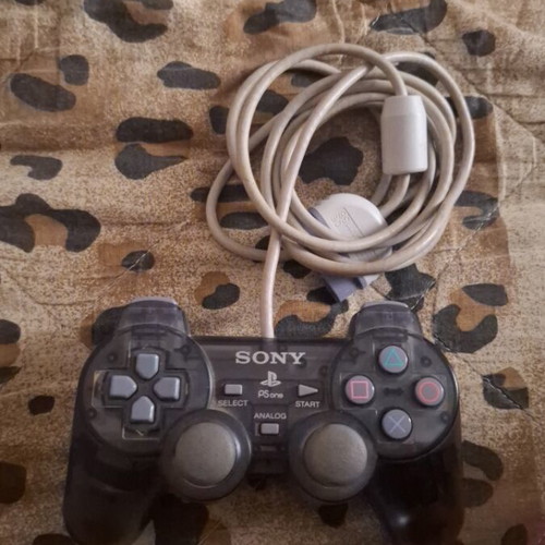 Sony PlayStation 2 console with 2 controllers, memory card and 5 games
