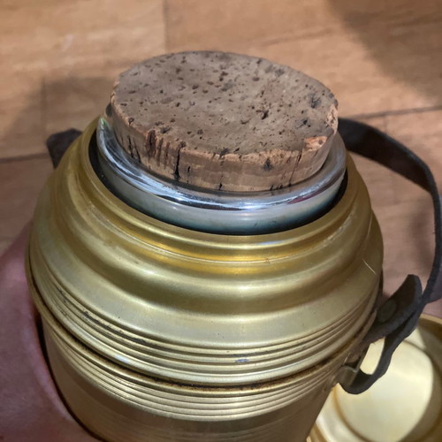 Vintage thermos used with cork and leather strap