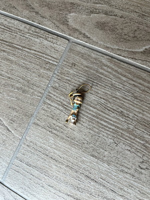 Betty Boop keychain charm with blue and beige details, gold clasp