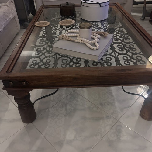Large wooden coffee table with glass and metal decoration