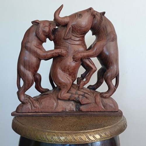 Hunting scene with buffalo and predators wood carving