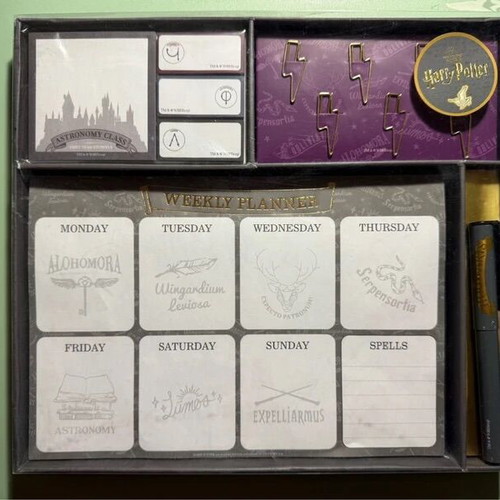 Harry Potter stationery set with pen, weekly planners, post-its, and lightning bolt clips