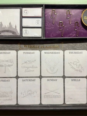 Harry Potter stationery set with pen, weekly planners, post-its, and lightning bolt clips