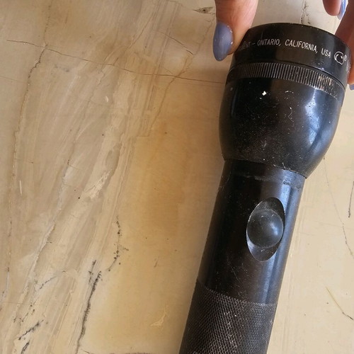 Flashlight used with swollen battery