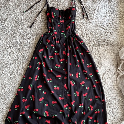 Black midi dress with cherry print and corset fit