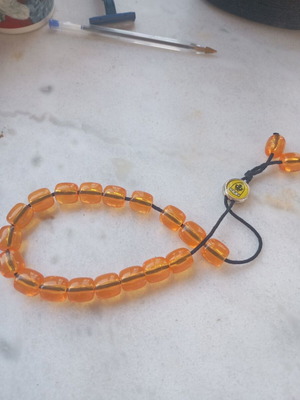 Komboloi new, yellow plastic with AEK emblem