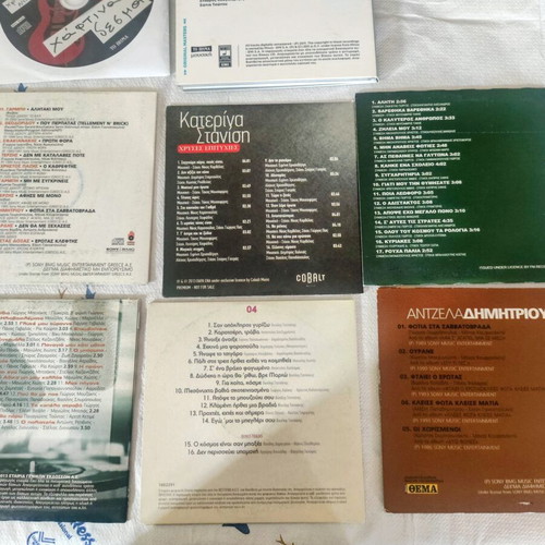 Set of 8 collectible CDs with famous Greek artists