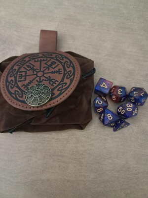 Runic leather dice bag with pink and purple D&D dice set