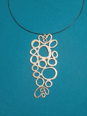 Handmade necklace new, melted silver on copper