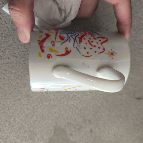 Porcelain mug like new with colorful design