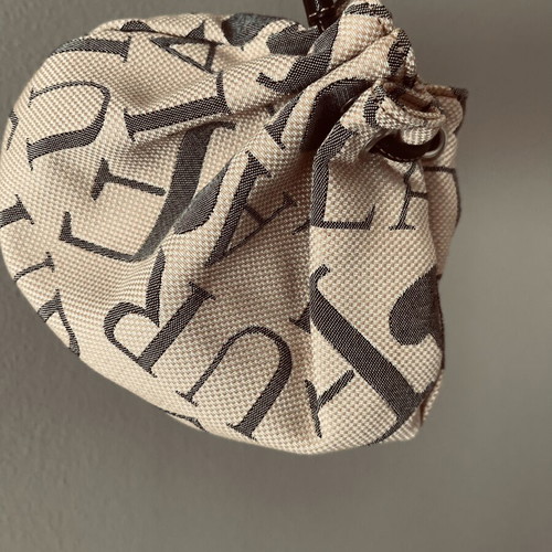 Furla pouch bag like new, monogram fabric and leather