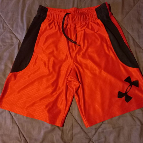 Under Armour men's sports shorts used, size Large, black and red