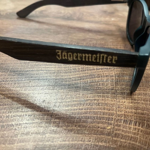 Jägermeister collectible sunglasses with bamboo arms, dark green frame