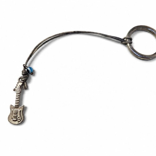 Guitar Keychain like new with metal detail and vintage blue eye