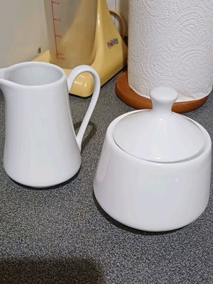 Sugar bowl and creamer set like new, porcelain