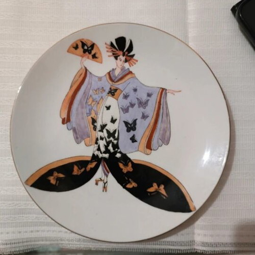 Vintage decorative porcelain plate with Japanese geisha design used