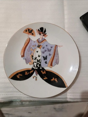 Vintage decorative porcelain plate with Japanese geisha design used