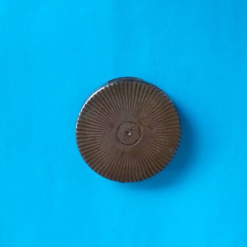 Antique powder compact used with metal bronze casing