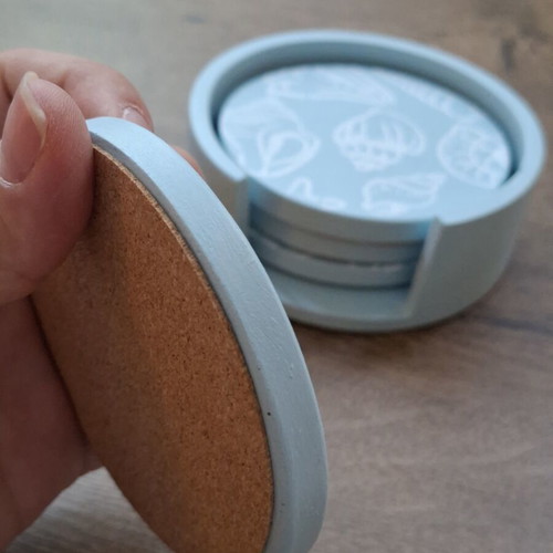 Handmade plaster coaster set with summer decoration and soft blue color