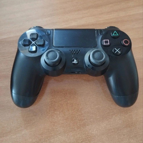 Sony PlayStation 4 Fat 500GB console with DualShock controller