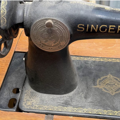 Singer sewing machine used with cabinet