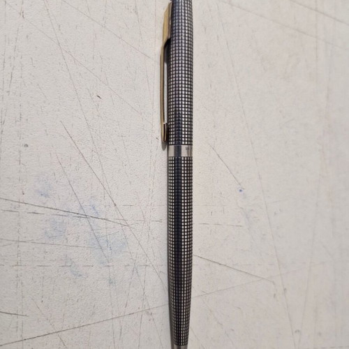 Parker pen in like new condition, possibly silver or silver-plated