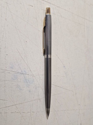 Parker pen in like new condition, possibly silver or silver-plated