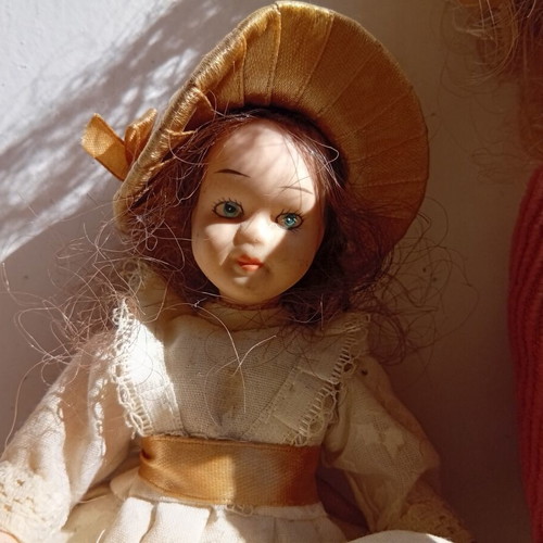 Porcelain dolls used, set of two 21 and 18 cm