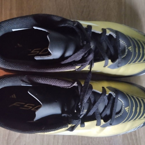 Adidas Messi football shoes, black and gold