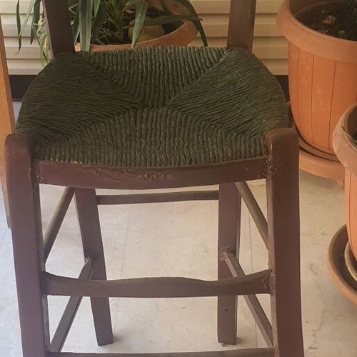 Wooden high chair with woven seat