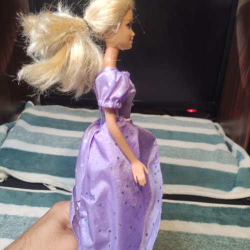 Barbie with lilac dress used, torn shoulders