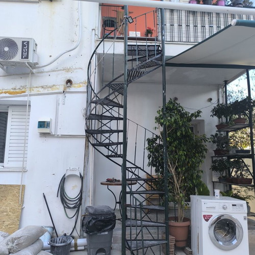Iron spiral staircase, outdoor, green cypress color