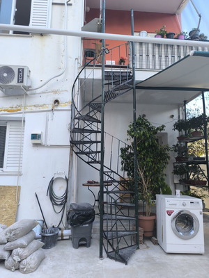 Iron spiral staircase, outdoor, green cypress color