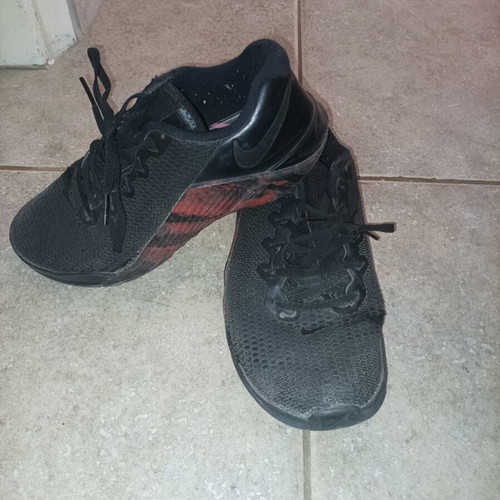 Nike athletic shoes in good condition with some wear, size 40