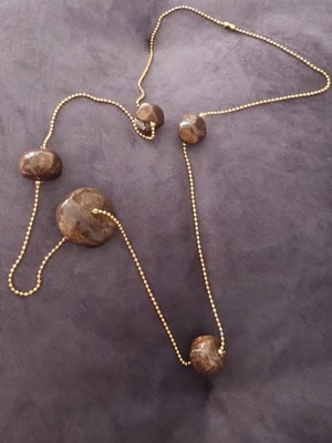 Faux necklace with long gold chain and large brown stones