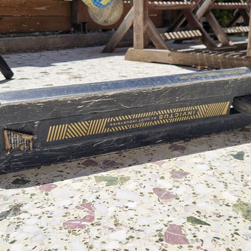 Root Industries Invictus Gold Rush freestyle scooter used with helmet and pads