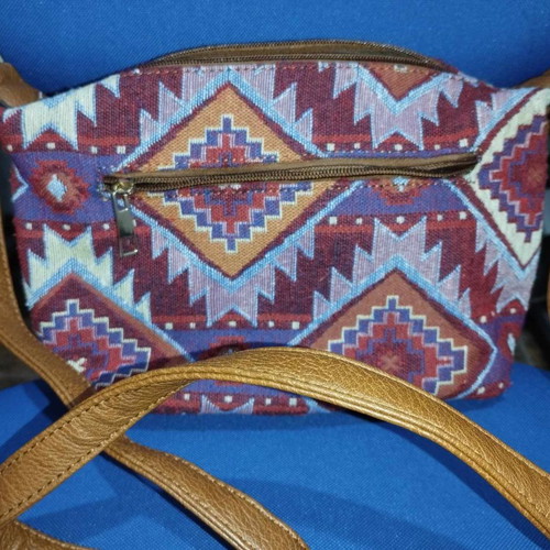 Crossbody bag used multicolor fabric and leatherette