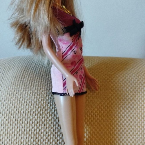 Barbie doll like new with purple dress and gold necklace from 2009 collection